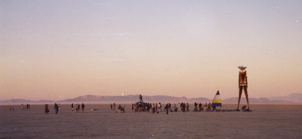 Pulling the rope to raise the man. Burning Man 1990